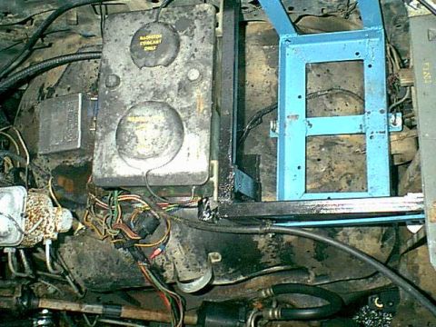 1983 Ford Bronco - to move the windshield washer i needed a better mount so i made a cage to wrap the battery and the washer mounts to the back of it.