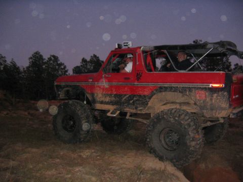1979 Ford Bronco - This lifted SUV is equipped for off-road adventures, seen here navigating a dirt path.