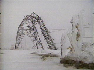1978 Ford Mustang II - A scene of a damaged industrial structure heavily coated in ice and snow during winter weather.