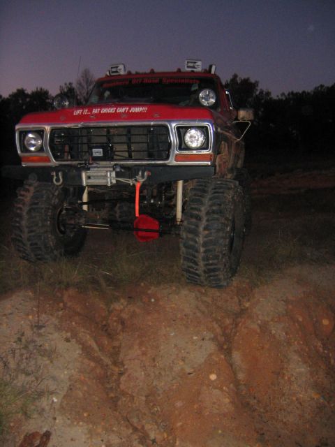 1979 Ford Bronco - This lifted 1979 Ford Bronco features a humorous decal on its grille and appears ready for off-road adventure.