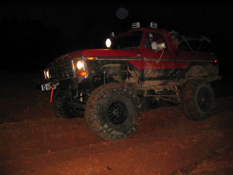 1979 Ford Bronco - This lifted 1979 Ford Bronco navigates a muddy terrain under the cover of darkness.