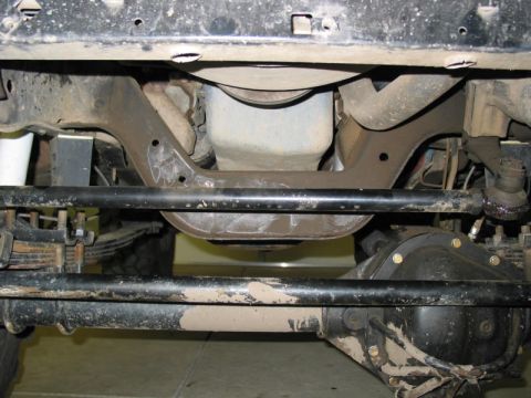 1981 Ford Bronco - Undercarriage components including steering linkage and front differential are visible in this photo.