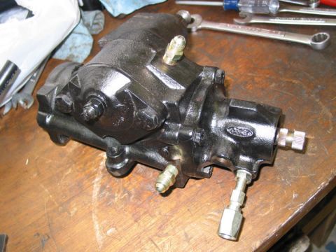 1981 Ford Bronco - Ford power steering gearbox with "Ford" oval logo visible on a wooden surface.