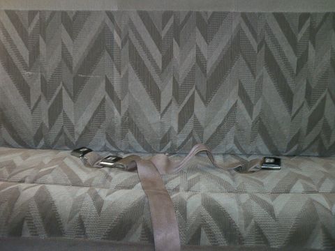 1995 Ford Bronco - Seatbelt and patterned upholstery visible inside a vehicle.