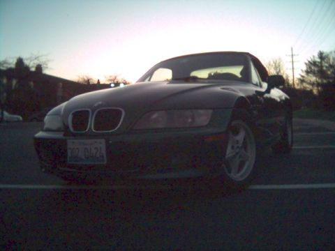 1996 BMW Z3 - A 1996 BMW Z3 convertible is parked outdoors during twilight, with a clear view of its front grille and headlights.