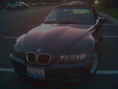 1996 BMW Z3 - A dark 1996 BMW Z3 convertible is seen from the front in a parking lot.