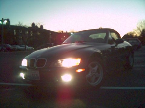 1996 BMW Z3 - Front view of a 1996 BMW Z3 convertible with headlights illuminated at twilight.