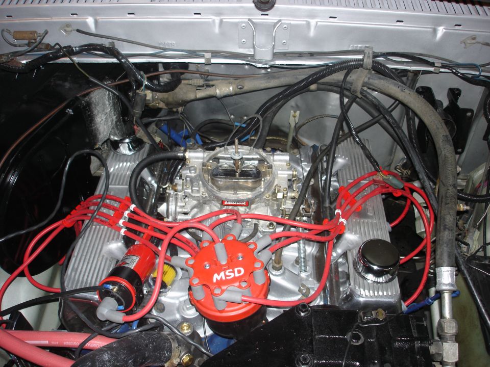 engine bay with V8 engine, MSD distributor, and red spark plug wires