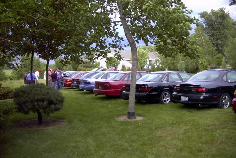1997 Ford Taurus rear view, black sedan parked on grass