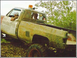 1976 Chevrolet Silverado 2500 - This old pickup truck appears to be in rough condition, possibly used for off-road activities.