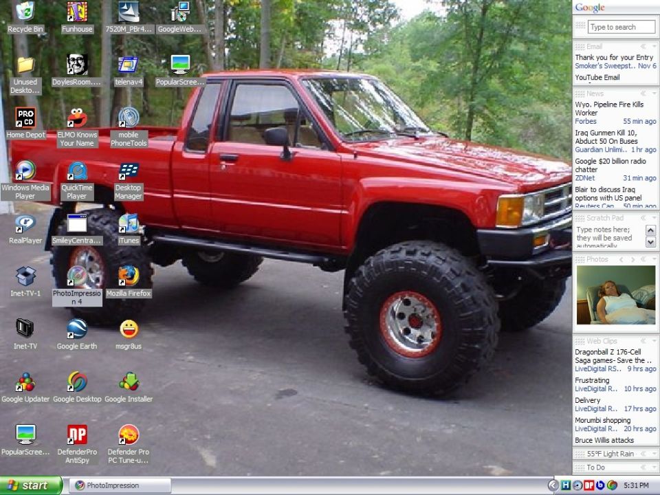 Red lifted pickup truck with large off-road tires