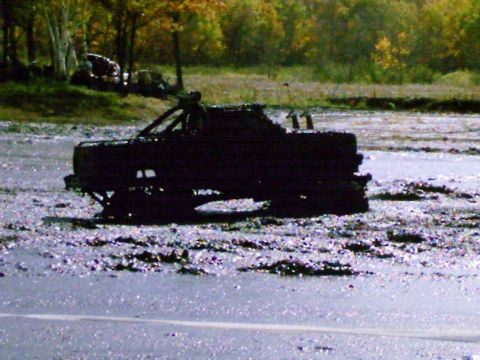 1976 Chevrolet Silverado 2500 - Muddy 1976 Chevrolet Silverado 2500 is stuck in a mud pit during a run.