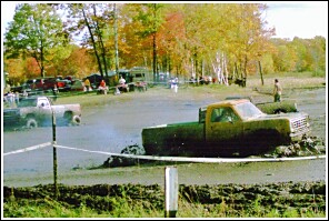 1976 Chevrolet Silverado 2500 - Mud bogging event with trucks stuck in the mire.