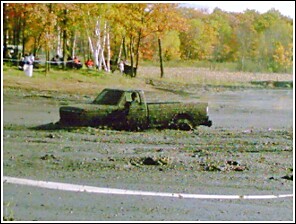 1976 Chevrolet Silverado 2500 - Mud run event shows a truck stuck deep in the mire.