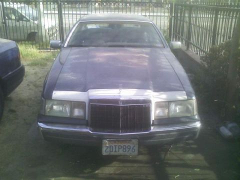 1989 Lincoln Continental - Front view of a 1989 Lincoln Continental Mark VII parked outdoors.