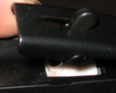 1990 Ford Bronco - A close-up view of a car's interior component, possibly a latch or handle mechanism.
