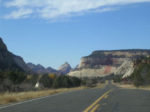 1975 Ford Ranchero - A scenic drive through a mountainous landscape with a road leading into the distance.