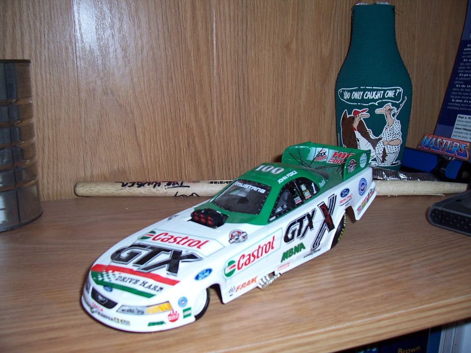 White and green drag racing toy car with GTX livery and number 100
