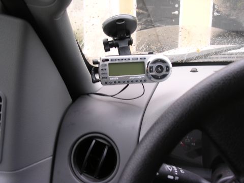 2006 Ford F-150 - Interior view of a vehicle's dashboard, showing a satellite radio receiver and part of the steering wheel.