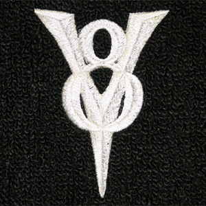2004 Ford Crown Victoria - A white V8 emblem is shown against a black textured background, with a website address at the bottom.