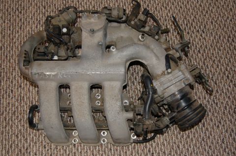 1996 Ford Probe - Engine intake manifold with "FAST KLS" written on it, likely from a car.