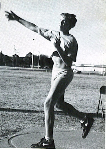 1986 Ford Bronco - An athlete prepares to throw the discus during a track and field event.