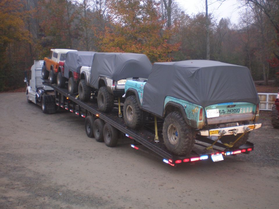Rear view of a teal 1969 Ford Bronco on a trailer, with "OLD HORSE" text visible