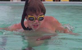 1991 Ford Bronco - A child swims in a pool wearing snorkeling gear.
