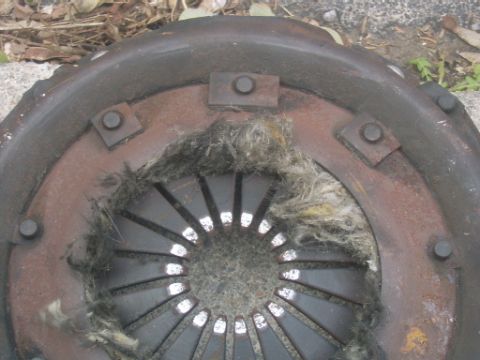 1990 Ford Bronco - Clutch disc shows significant wear and tear.