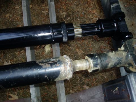1978 Ford F-250 - Comparison of a new driveshaft with an old, worn one, highlighting the difference in condition.