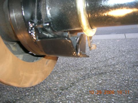1996 Ford Bronco - A close-up view of a vehicle's rear axle assembly and brake rotor.
