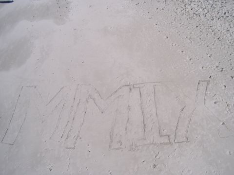 1994 Ford Probe - MMLX written in sand on a beach.