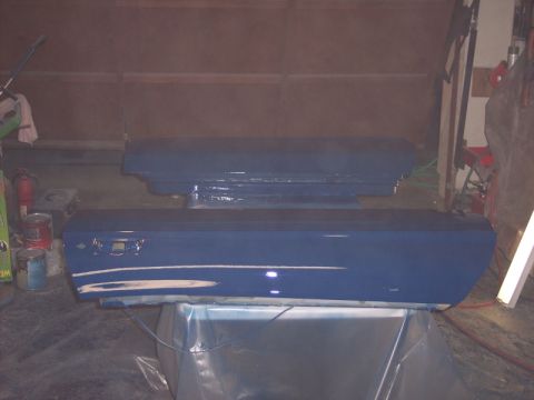 1971 Ford Mustang - Two car doors are being painted blue in a garage setting.