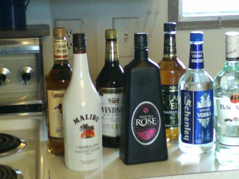 1989 Ford Bronco - A collection of various liquor bottles displayed on a kitchen counter.