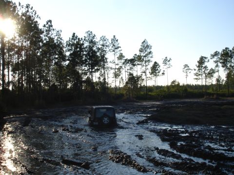 1989 Ford Bronco - Off-roading adventure in the mud with a Jeep Wrangler.