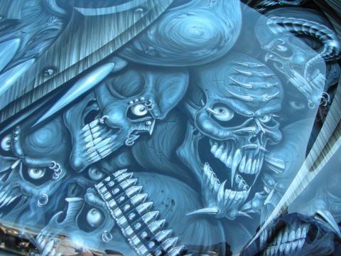1998 Ford Crown Victoria - Detailed airbrushed automotive paint art in blue and gray tones depicting menacing skulls and a hooded figure.