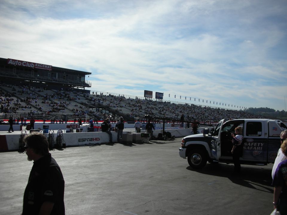 White Safety Safari truck at Auto Club Raceway dragstrip with grandstands