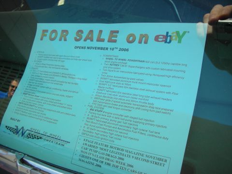 1998 Ford Crown Victoria - Windshield sale placard advertising a custom hot rod on eBay with detailed engine and build specs.