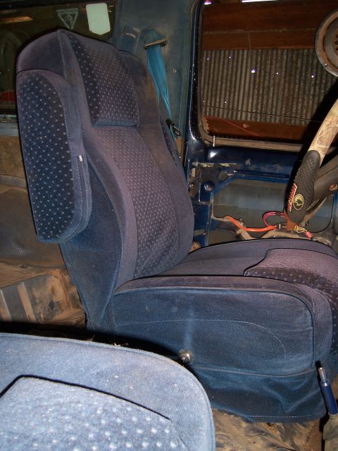 1983 Ford Bronco - Interior view of a 1983 Ford Bronco, highlighting the blue velour seating and dashboard details.