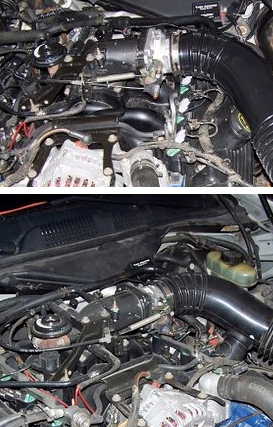 2000 Ford Crown Victoria - Engine bay of a 2000 Ford Crown Victoria, showing the intake system and various engine parts.