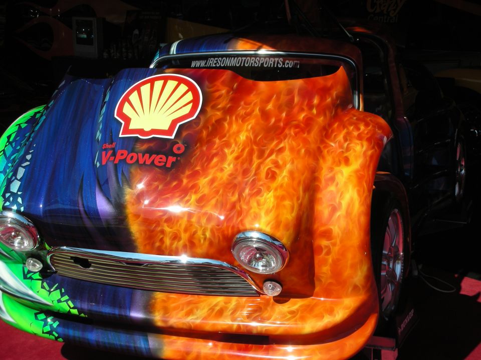 Front of small car with airbrushed flames and Shell V-Power logo on hood