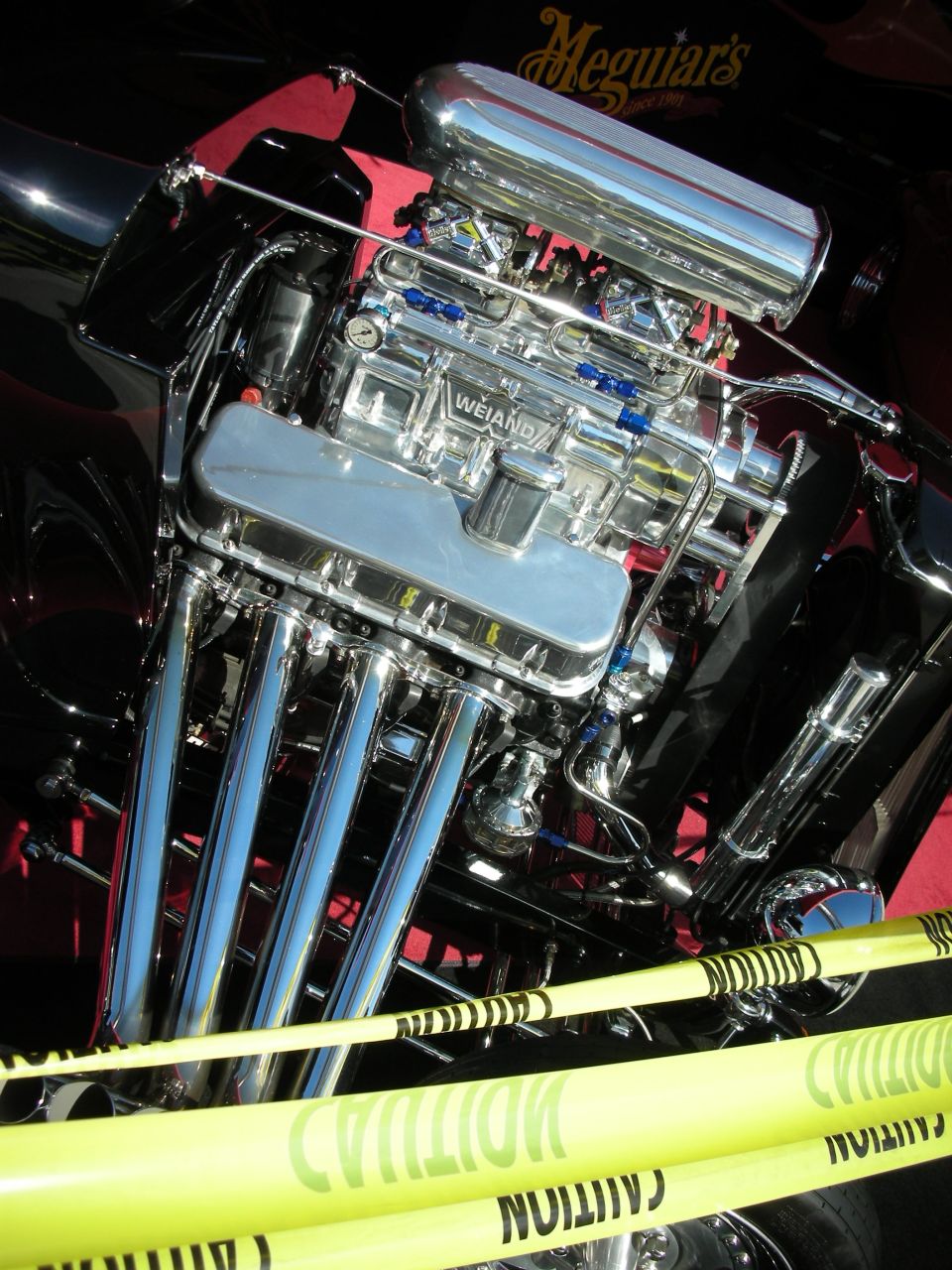 Chrome blown V8 engine with Weiand blower and zoomie headers in hot rod