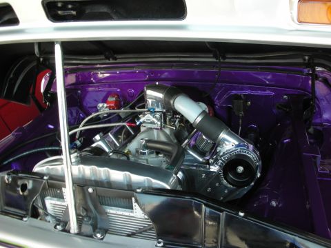 1998 Ford Crown Victoria - chrome-accented V8 sits in the glossy purple engine bay of a custom show car.