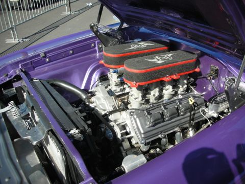 1998 Ford Crown Victoria - V8 fitted with twin red-and-black air cleaners sits in a purple-painted engine bay.