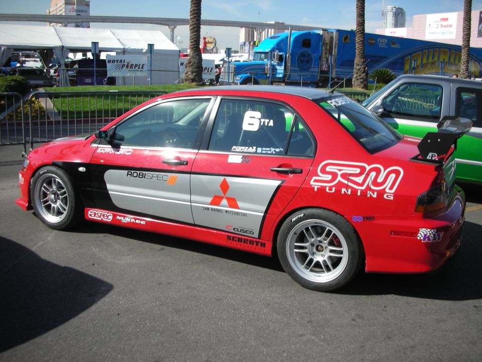Red-and-silver Mitsubishi Lancer Evolution race car with SRM Tuning livery