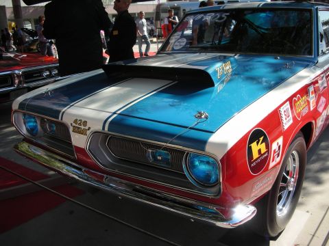 1998 Ford Crown Victoria - Front view of a blue-and-red Plymouth Barracuda race car with a scooped hood badged 426 Hemi and racing sponsor decals.
