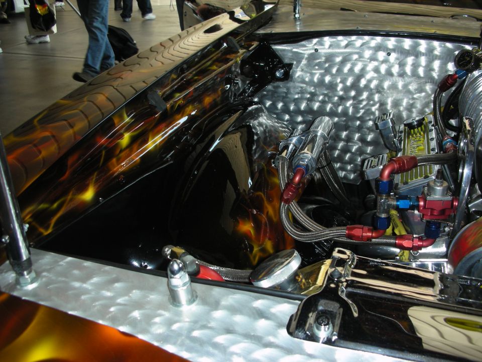 Engineered metal compartment with braided fuel lines and AN fittings under a flamed lid