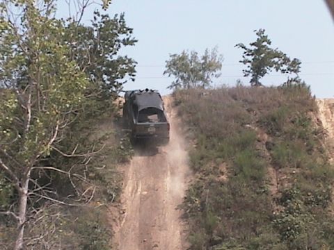 1988 Ford Bronco - about to crest over the top of the hill