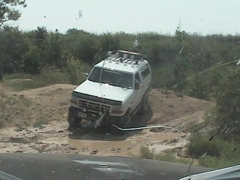 1988 Ford Bronco - big mike dropping into a small mud pit