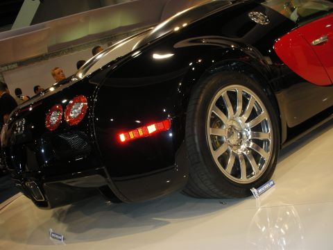 1998 Ford Crown Victoria - Bugatti Veyron shown at an auto show, its distinctive taillights and wheel design.